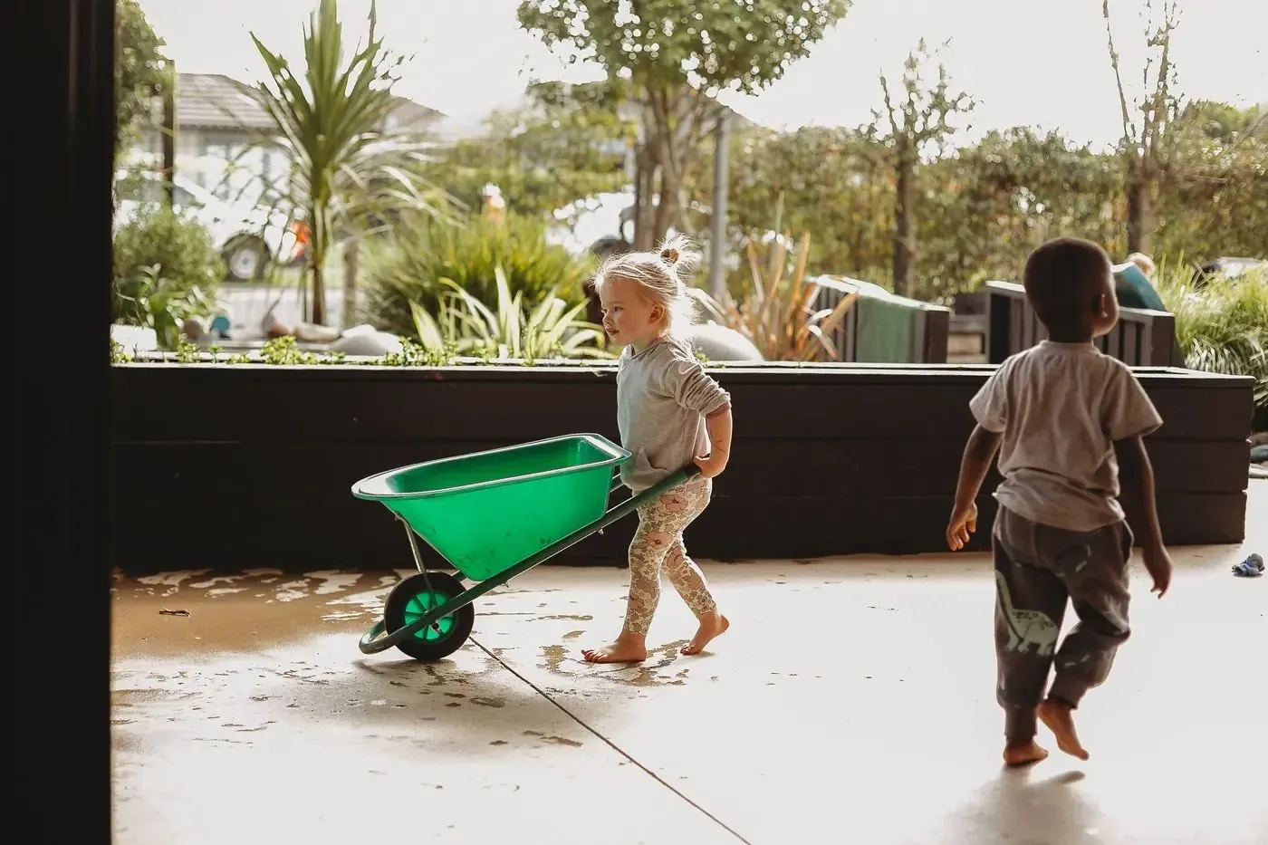 Children playing with wheelbarrows at Canopy